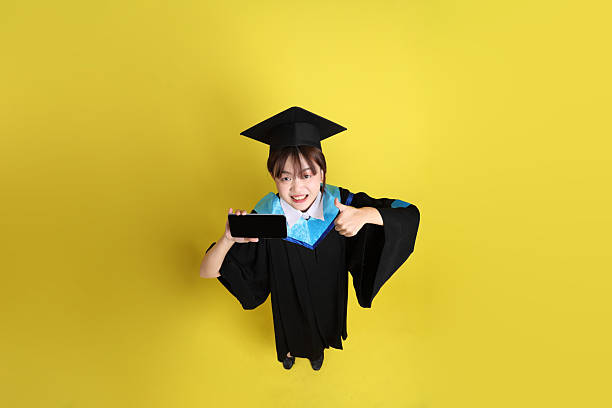 istock 20s woman in Graduation gown 2208617426