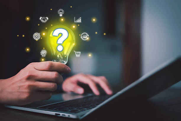 istock Innovation concept and inspiration. Businessman holding creative light bulb with question mark icon. Industry and marketing development network. Strategic planning. Modern business. 2208617984