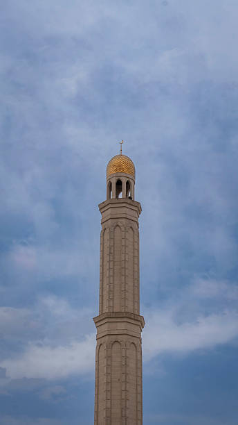 istock minaret of the mosque on a blue sky background 2208621371