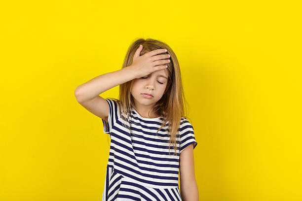 istock Beautiful little girl on yellow background 2208625603