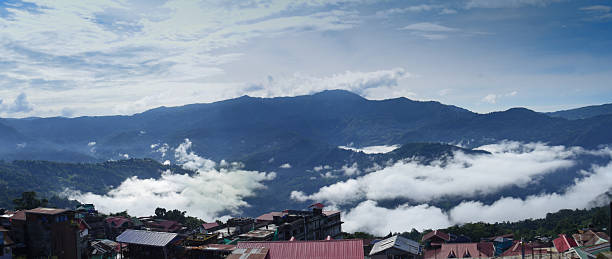 istock Mountainous Landscape with Clouds Above a Village 2208626688