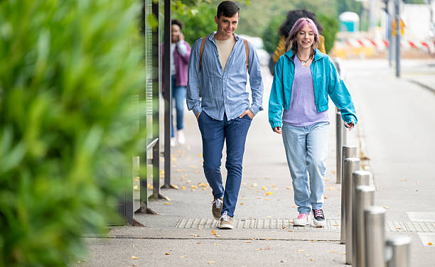 istock Young Friends Share Joyful Strides in Cityscape 2208627710
