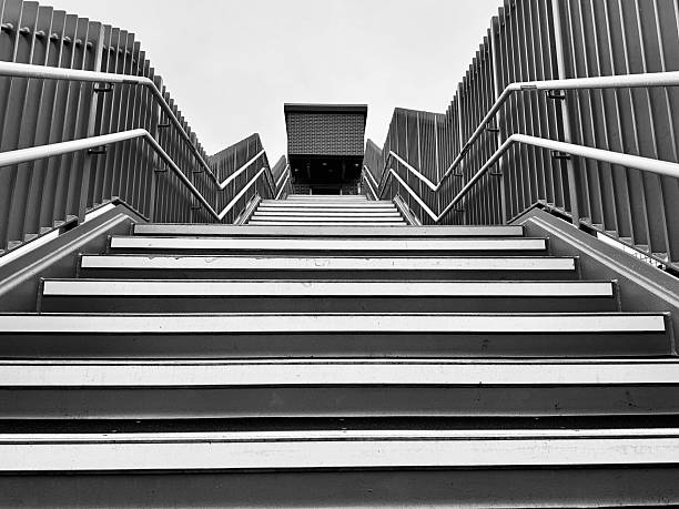 istock Looking up a steep outdoor staircase 2208631670