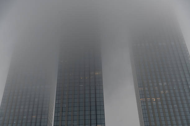 istock Fog envelops skyscrapers in a misty urban setting at dawn 2208633376