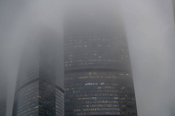 istock Skyscraper enveloped in fog creates a mysterious urban landscape 2208633648