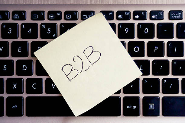 istock A close-up of a laptop keyboard with a yellow sticky note displaying the text 