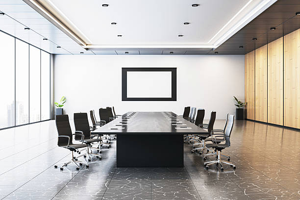 istock Modern corporate conference room interior with long table, black chairs, wooden wall paneling, and bright city background lighting setup. 3D Rendering 2208636016