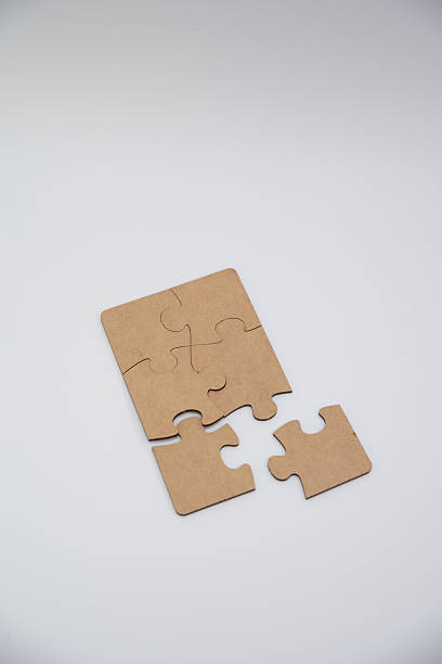 istock monochromatic puzzles in a pile lying on a white background 2208639007