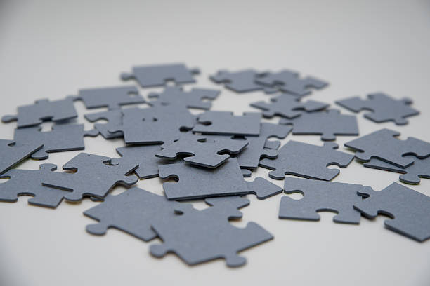 istock monochromatic puzzles in a pile lying on a white background 2208639017