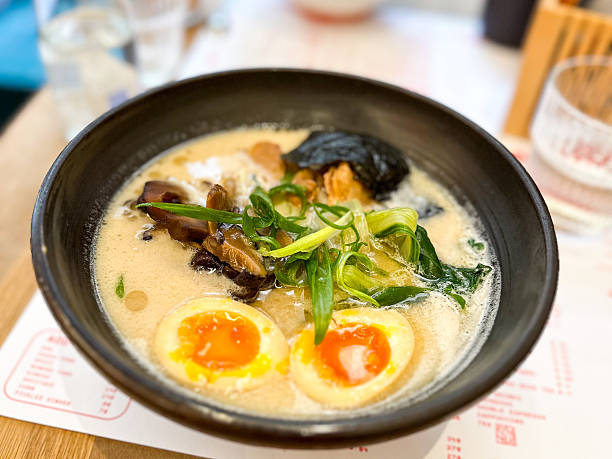 istock Miso Ramen Asian noodles soup with beef, egg on a table 2208640514