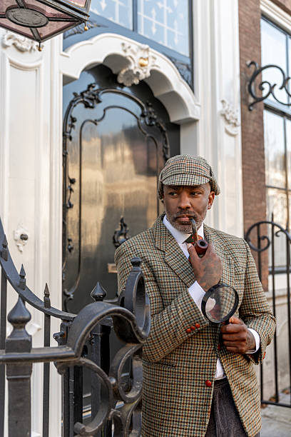 istock Handsome senior black man dressed as a classic private detective 2208643315