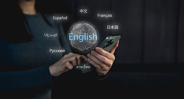 istock A businessman holding a smartphone displays various languages, highlighting global communication and translation. 2208643645