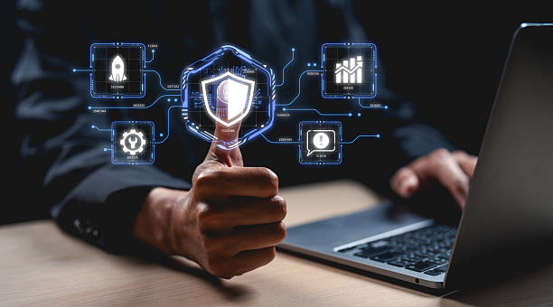 istock A hand holds a digital shield, surrounded by icons representing cybersecurity metrics, illustrating the intersection of technology and protection. 2208643694