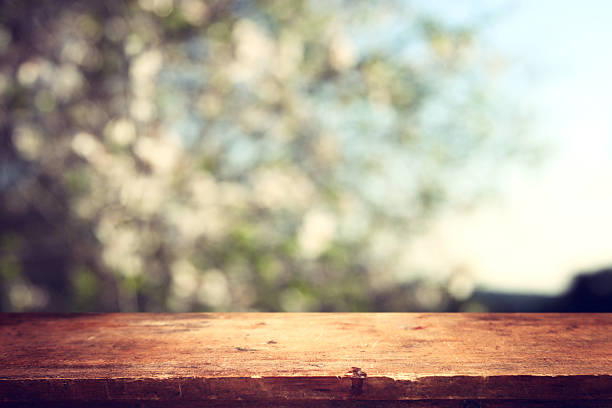 istock Empty rustic table in front of countryside background. product display and picnic concept 2208643720