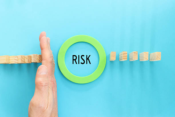 istock stopping the domino effect. executive and risk control concept 2208643725