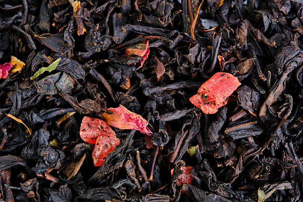 istock Black and green leaf tea with fruits and berries. 2208643978