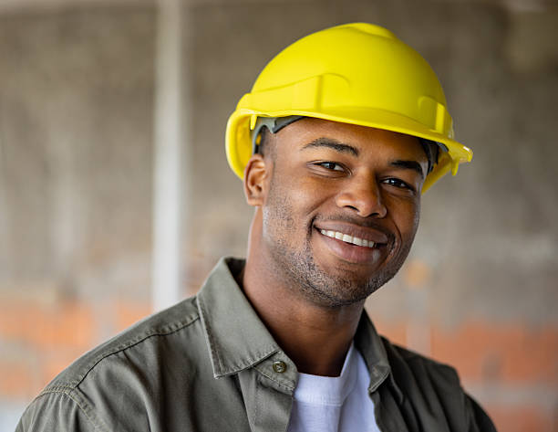 istock Portrait of a happy construction worker smiling at a building site 2208646759