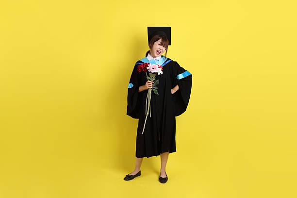 istock 20s woman in Graduation gown 2208647444