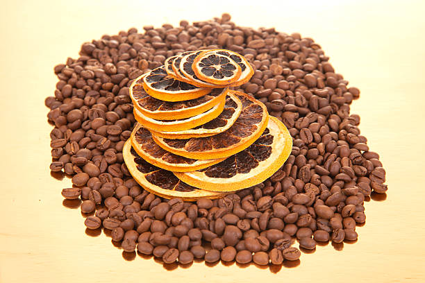 istock dried orange slices resting on roasted coffee beans, perfect for coffee lovers and culinary inspiration. coffee aroma and taste descriptors 2208657320
