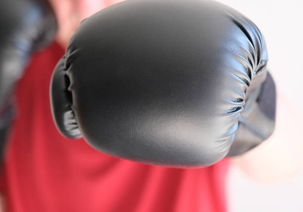 istock Adult male boxer throwing punches towards camera 2208658225