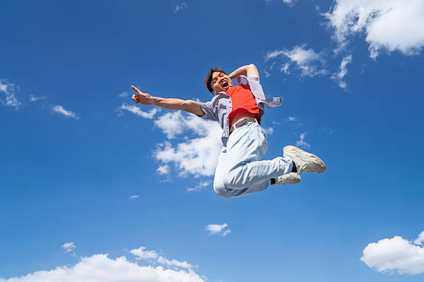 istock Happy Man Jumping Blue Sky Background 2208661951