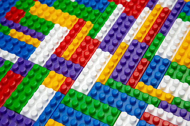 istock Abstract background texture of colored constructor blocks. Background of colorful plastic part of constructor. Pile of colored toy bricks. 2208666530