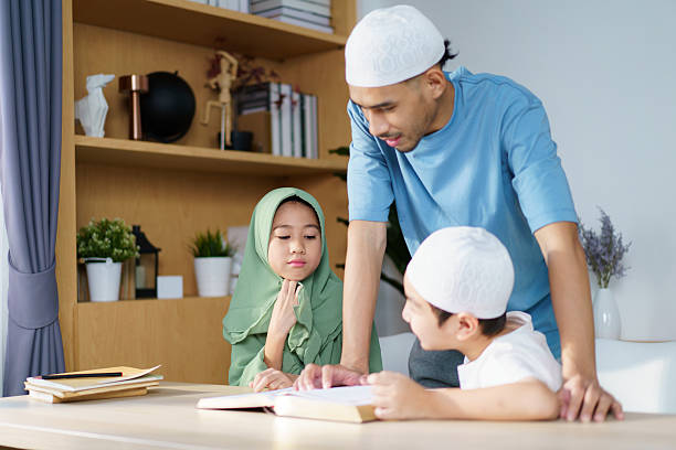 istock Man is teaching homework for his children. 2208666957