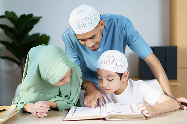 istock Man is teaching homework for his children. 2208666960