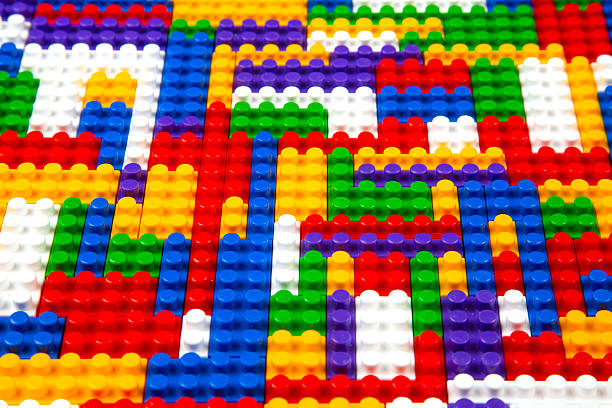 istock Abstract background texture of colored constructor blocks. Background of colorful plastic part of constructor. Pile of colored toy bricks. 2208666962