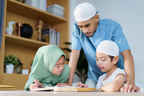 istock Man is teaching homework for his children. 2208666965