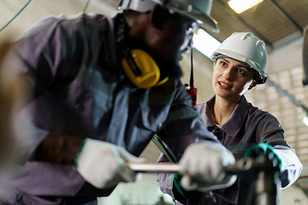 istock A technicians team working together in factory. A workers inspecting machines 2208667061