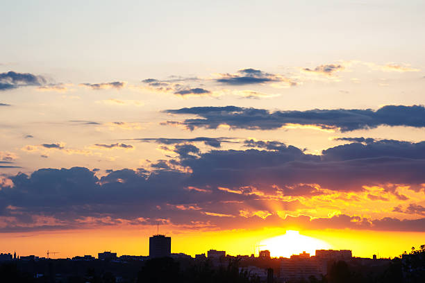 istock majestic sky after sunset, featuring a gradient from warm red to cool indigo, with scattered clouds catching the last rays of sun in a spectacular display of color 2208667414
