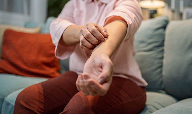 istock Mature woman with itchy skin 2208667920