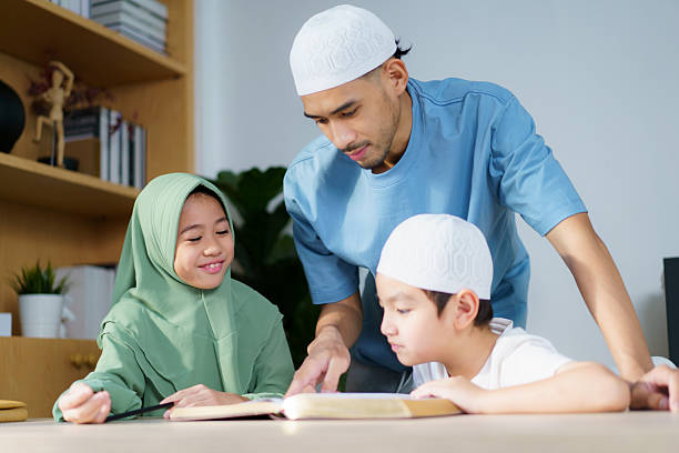 istock Man is teaching homework for his children. 2208668196