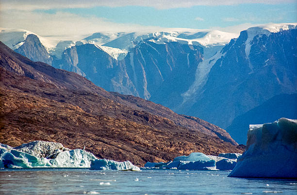 Landscape with icebergs and a wonderful sky with strange clouds in the Disko Bay area in Ilulissat, Greenland
