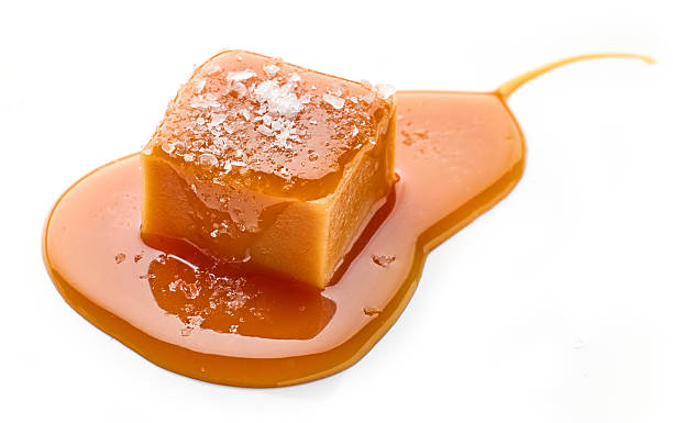 istock salted caramel candy in melted caramel sauc 2208672350