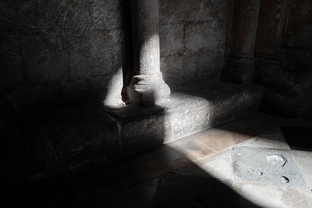 Light shining through window creating window shadow on empty room floor