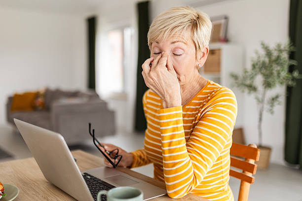 istock Tired Mature Woman Working Remotely from Cozy Living Space 2208684345