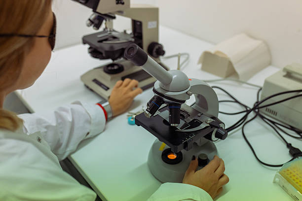 istock Woman scientist with microscope and data analysis in laboratory, research and breakthrough 2208685330