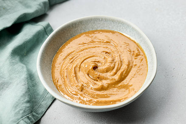 istock bowl of thai peanut sauce 2208686112