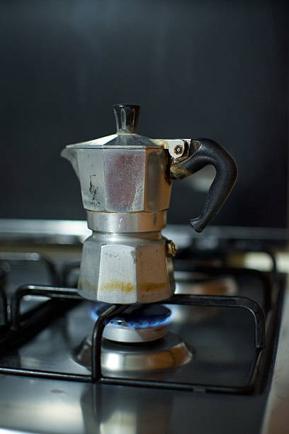 istock an old functional italian moka coffee machine on gas stove 2208686724
