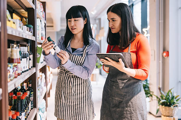 istock Two women working together in the organic store, using a tablet to update inventory 2208691100