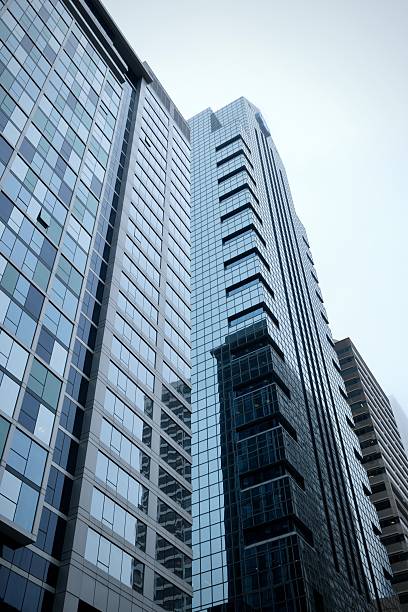 istock Looking Up at Blue Glass Buildings Downtown (Philadelphia, Pennsylvania, USA) 2208692122