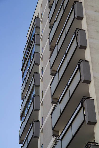 istock Apartment building with raws of balconies 2208692131