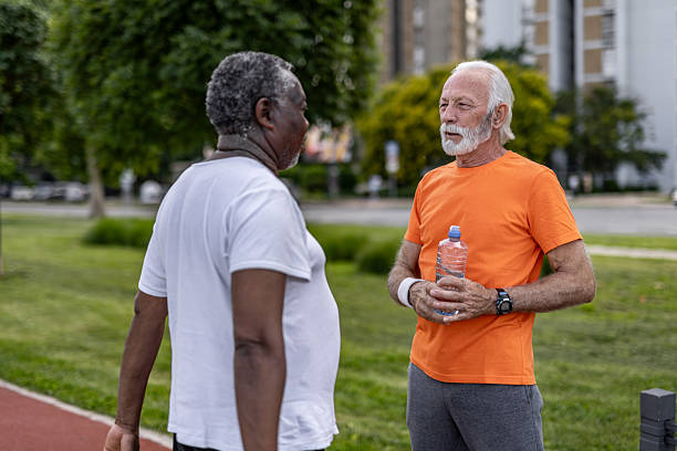 istock Two senior men talking after exercising in a park 2208692274