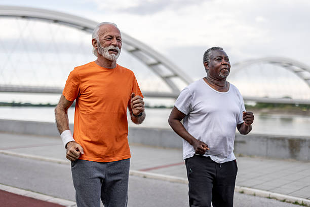 istock Two senior men running near river under bridge 2208692364
