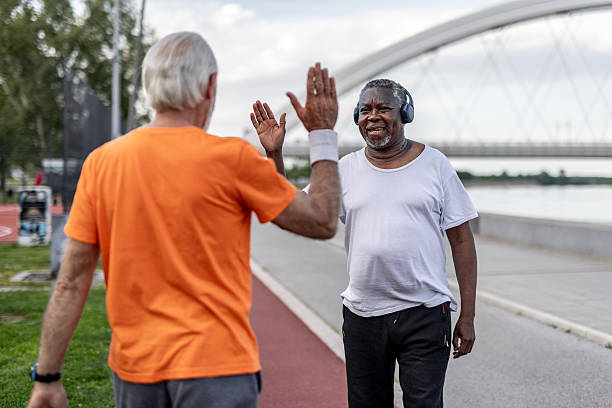 istock Two senior men giving high five after exercising outdoors 2208692372