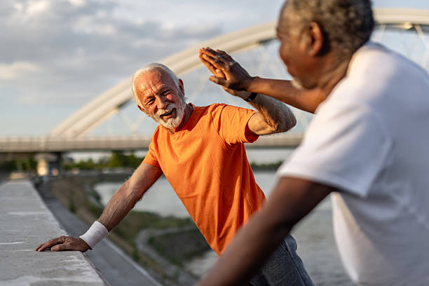 istock Two senior men giving high five after exercising outdoors 2208692616