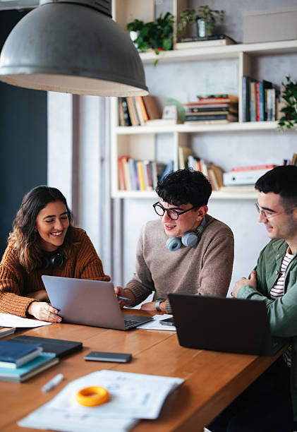 istock Group of Students Collaborating on Academic Project in a Cozy Study Space 2208695134