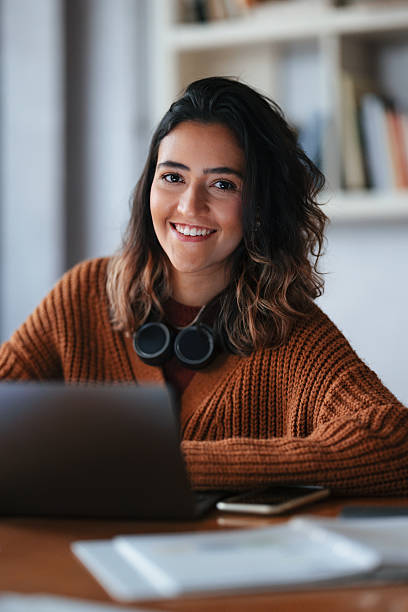 istock Young Professional Working Remotely Using a Laptop and Headphones 2208695678
